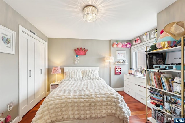 bedroom featuring a closet and wood finished floors