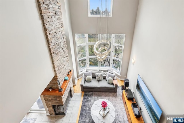 sitting room with tile patterned floors and a high ceiling