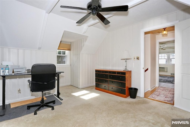 home office with an AC wall unit, ceiling fan, a decorative wall, and carpet floors