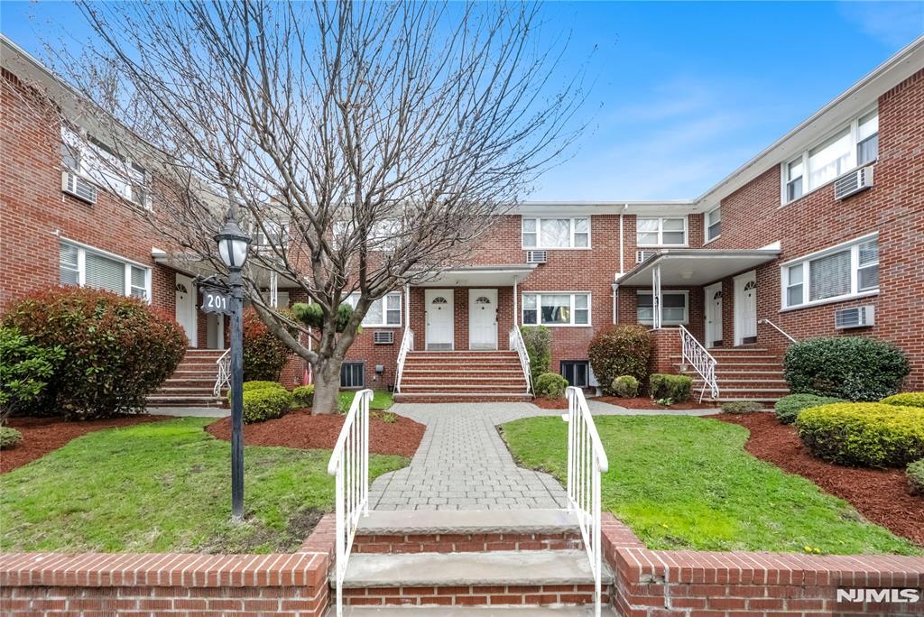 201 Oakdene Pl Unit D2, Cliffside Park, NJ 07010 - multi unit property with stairs, a wall unit AC, brick siding, and a front yard