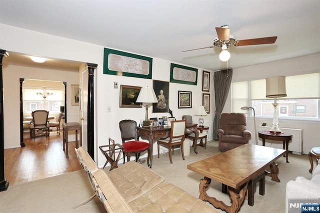311 Grand Ave Unit 23, Englewood, NJ 07631 - living room with light wood-style floors and ceiling fan with notable chandelier
