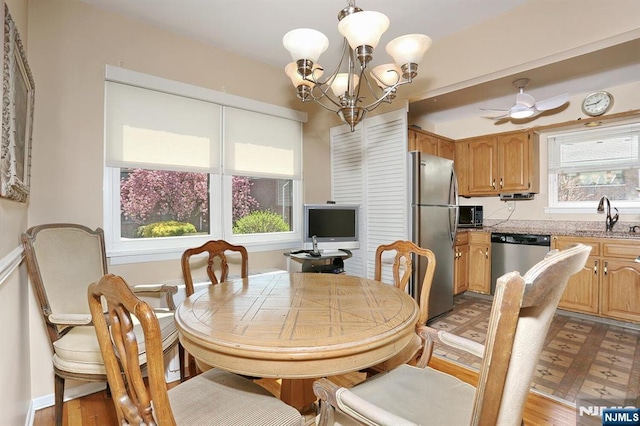 311 Grand Ave Unit 23, Englewood, NJ 07631 - dining area featuring light wood finished floors and ceiling fan with notable chandelier