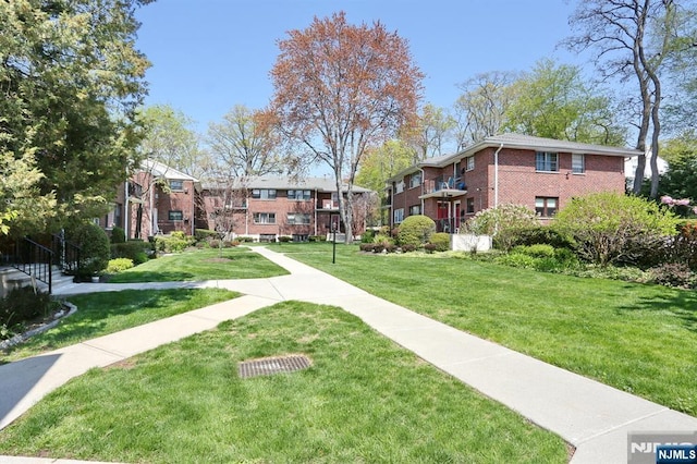 311 Grand Ave Unit 23, Englewood, NJ 07631 - view of home's community featuring a yard