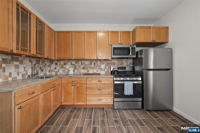 85 Anderson Ave, Wallington, NJ 07057 - kitchen with stainless steel appliances, wood finish floors, a sink, and tasteful backsplash