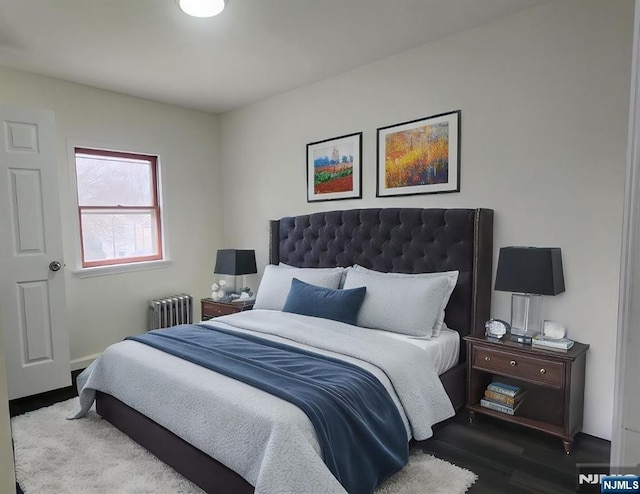 85 Anderson Ave, Wallington, NJ 07057 - bedroom featuring radiator and dark wood-style flooring