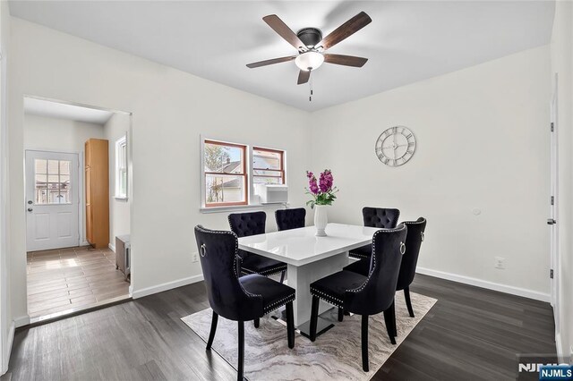 85 Anderson Ave, Wallington, NJ 07057 - dining area with dark wood-style floors, baseboards, and a ceiling fan