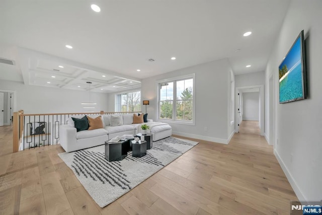 living room with coffered ceiling, light wood-style floors, visible vents, and recessed lighting