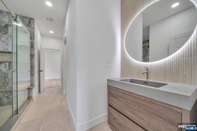 full bath with recessed lighting, tile patterned floors, visible vents, vanity, and a marble finish shower
