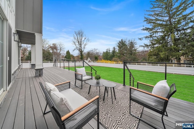 deck featuring a yard and an outdoor hangout area