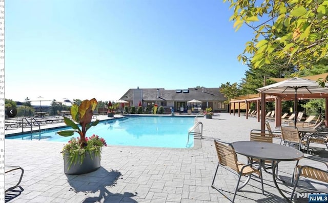44 Southerland Dr, Mahwah, NJ 07430 - community pool featuring a patio area and fence