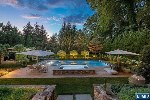 354 Hardenburgh Ave, Demarest, NJ 07627 - swimming pool with an in-ground hot tub, a patio, and a lawn