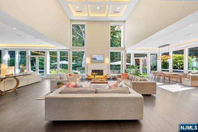 354 Hardenburgh Ave, Demarest, NJ 07627 - living room featuring a towering ceiling, coffered ceiling, wood finished floors, recessed lighting, and a fireplace