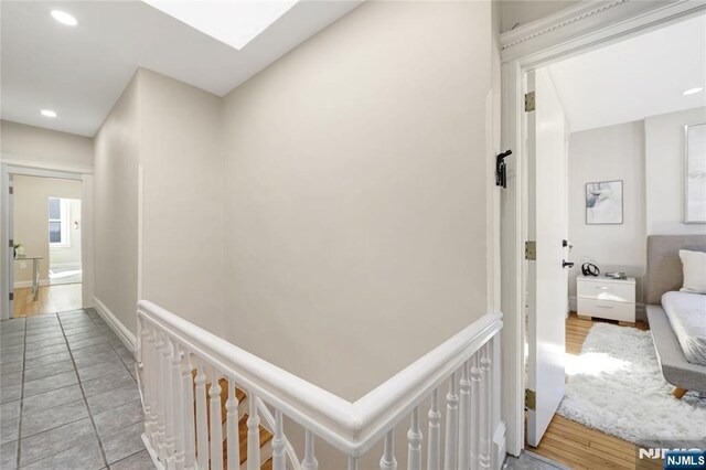 hallway with recessed lighting