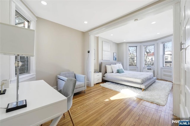 bedroom with recessed lighting and light wood-type flooring
