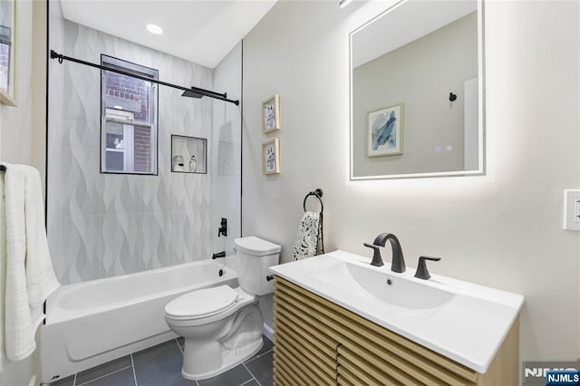 full bath with tile patterned floors, shower / bathtub combination, vanity, and toilet