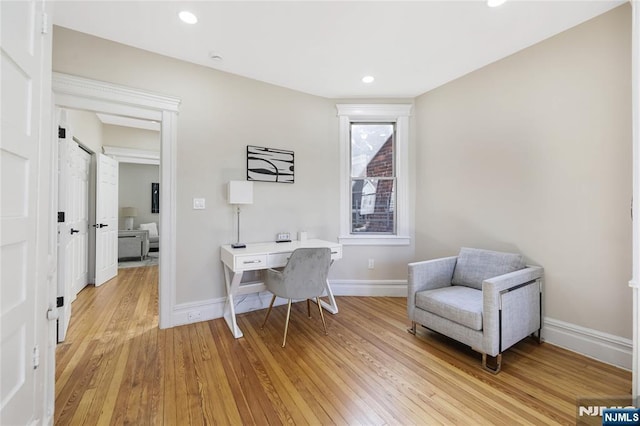 office with baseboards, light wood-style floors, and recessed lighting