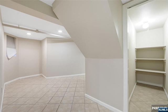 bonus room with recessed lighting, tile patterned flooring, and baseboards