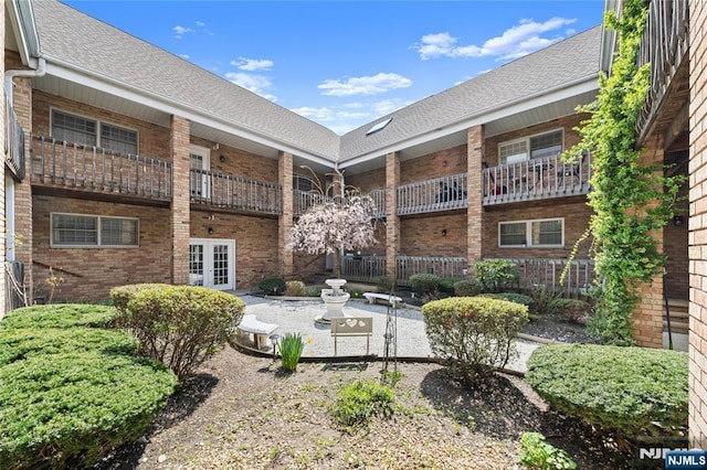 view of property's community featuring a patio