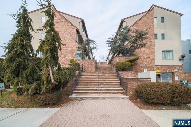 1323 15th St, Fort Lee, NJ 07024 - view of property featuring stairway