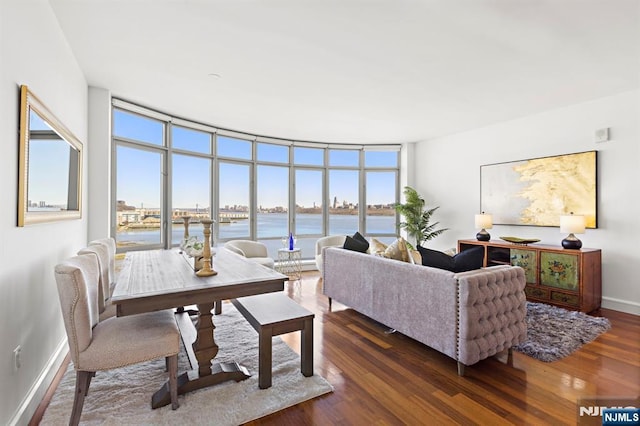 8100 River Rd Unit 1013, North Bergen, NJ 07047 - living room with dark wood-style flooring, baseboards, and a water view