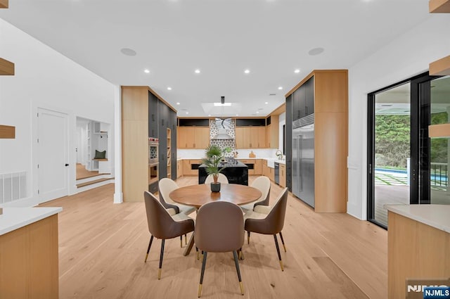 dining room with recessed lighting, visible vents, and light wood finished floors