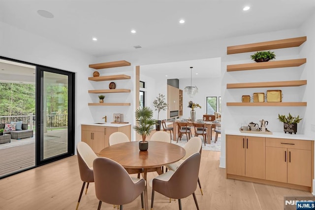 dining area with recessed lighting, light wood-style floors, and plenty of natural light