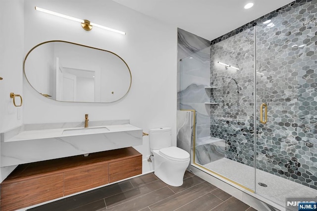 full bath featuring recessed lighting, wood tiled floor, toilet, vanity, and a stall shower