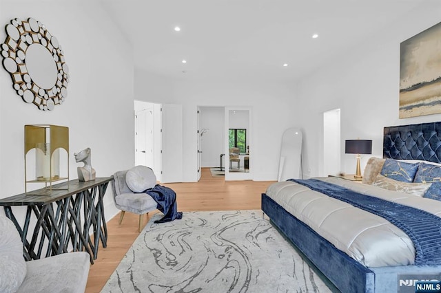 bedroom featuring recessed lighting and light wood-style flooring
