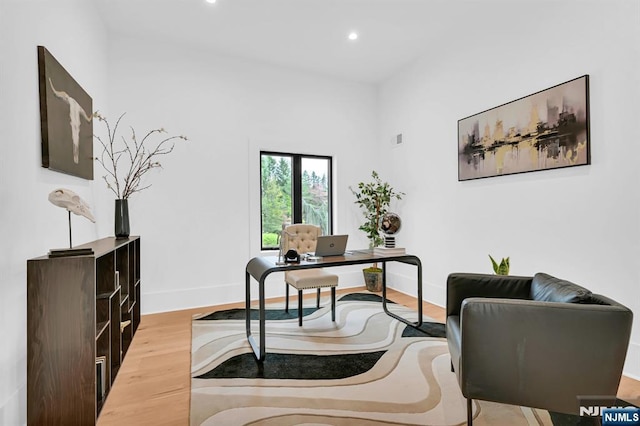 office with baseboards, wood finished floors, and recessed lighting