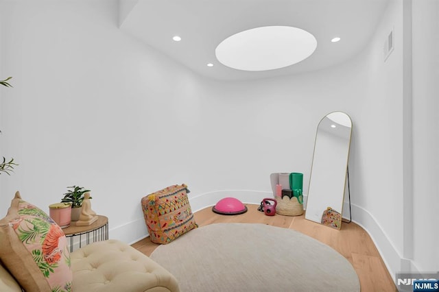 playroom featuring baseboards, wood finished floors, visible vents, and recessed lighting
