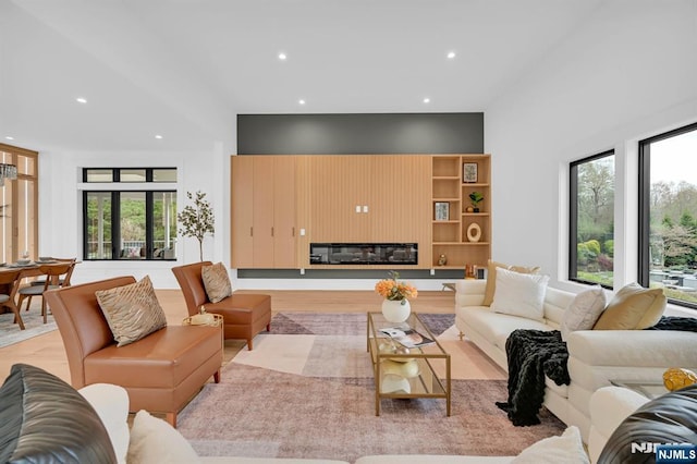 living room featuring a wealth of natural light and recessed lighting