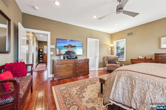 bedroom featuring wood finished floors, visible vents, and recessed lighting