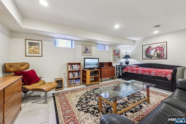 living area featuring recessed lighting, visible vents, and light tile patterned floors