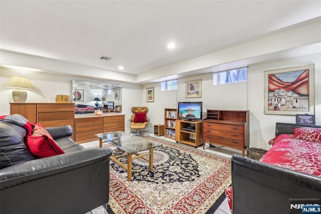 living room featuring visible vents