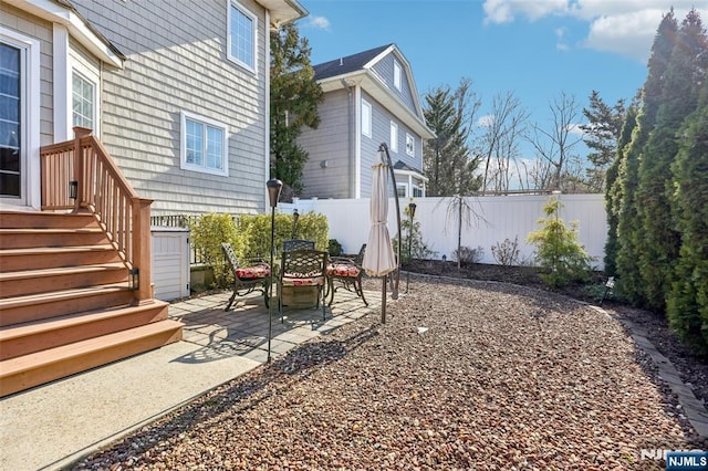 view of yard with a patio area and a fenced backyard