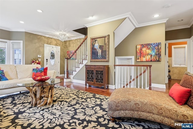 living area featuring baseboards, wood finished floors, recessed lighting, and ornamental molding