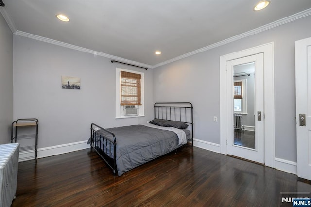 bedroom with radiator, baseboards, recessed lighting, ornamental molding, and wood finished floors