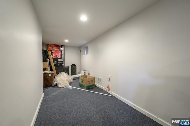 interior space featuring recessed lighting, visible vents, carpet flooring, and baseboards