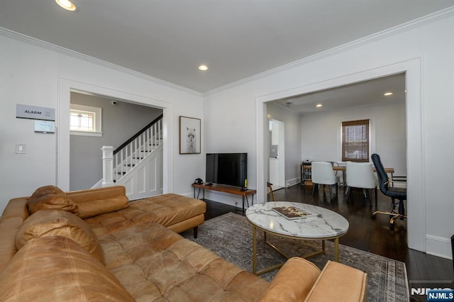 living area with recessed lighting, wood finished floors, stairs, and crown molding