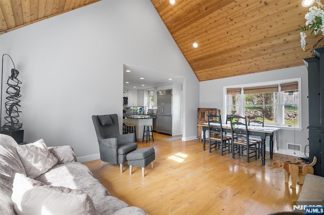 living room featuring baseboards, recessed lighting, and wooden ceiling