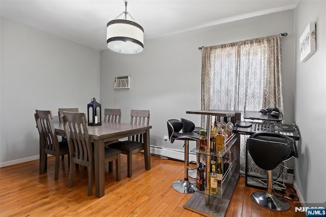 23 Foundry St, Newark, NJ 07105 - dining room featuring baseboards, a wall unit AC, and wood-type flooring