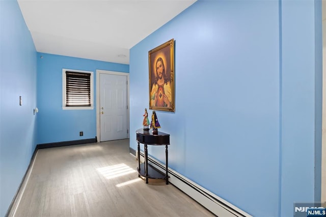 23 Foundry St, Newark, NJ 07105 - interior space with a baseboard radiator, baseboards, and light wood-style flooring