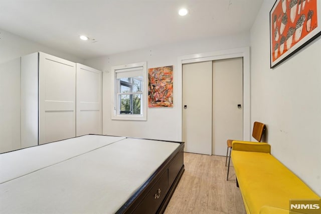 bedroom featuring recessed lighting and light wood finished floors