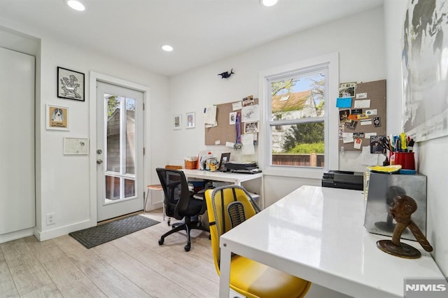 office area featuring recessed lighting, baseboards, and light wood-style floors