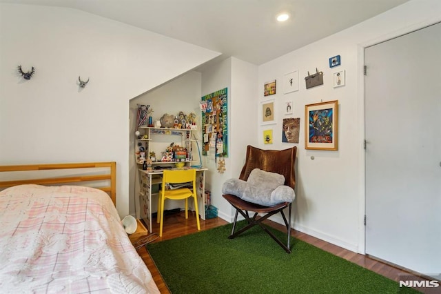bedroom featuring recessed lighting and wood finished floors