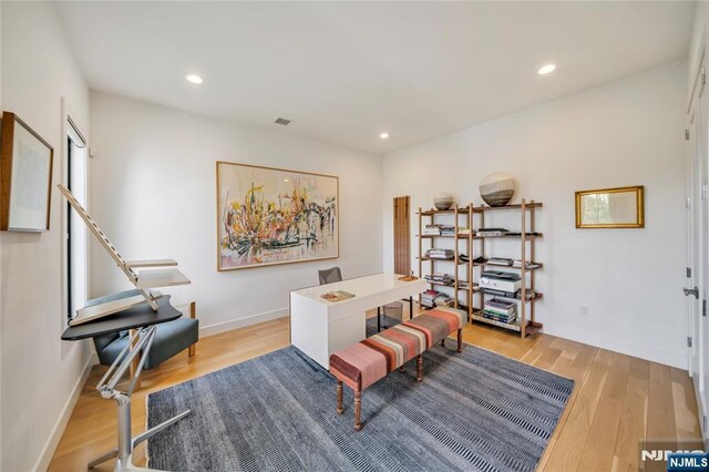 office featuring visible vents, recessed lighting, wood finished floors, and baseboards