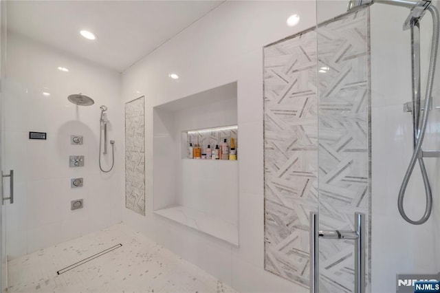 bathroom with a shower stall