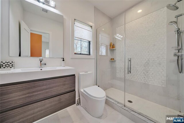 full bath with a shower stall, vanity, toilet, marble finish floor, and visible vents