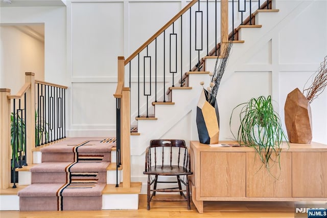 stairs with wood finished floors