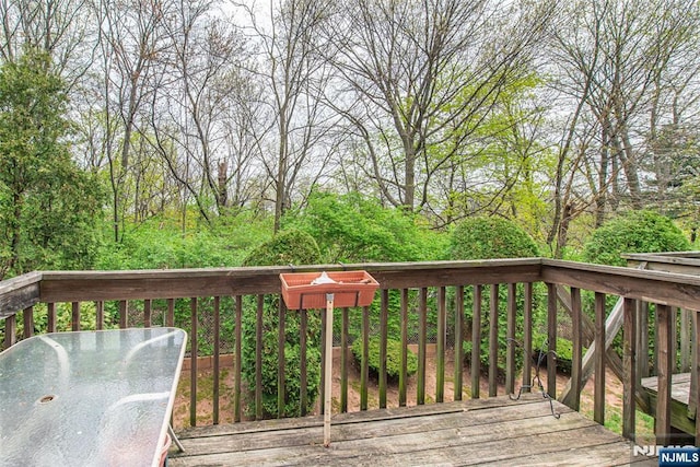deck featuring outdoor dining area